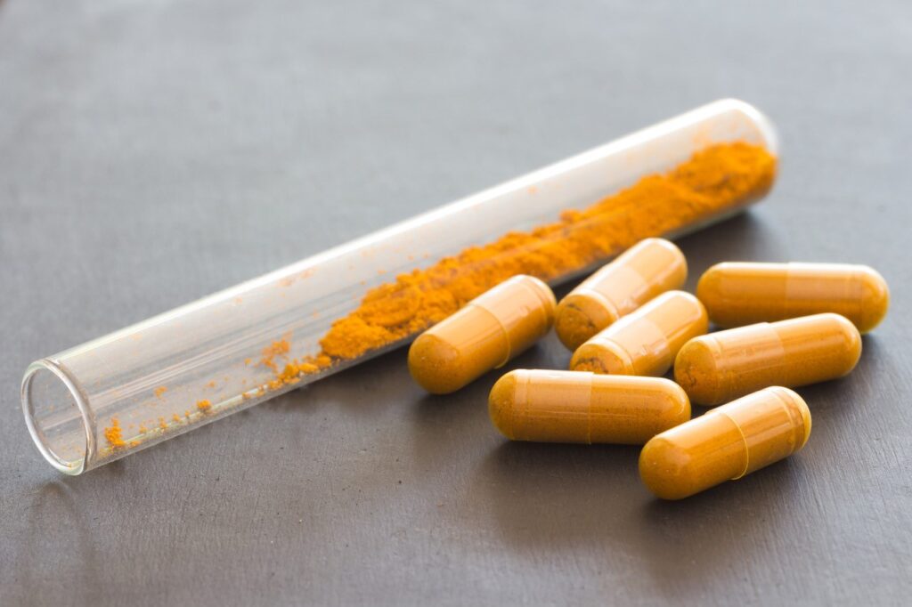 Curcumin Supplement Capsules and Test Tube